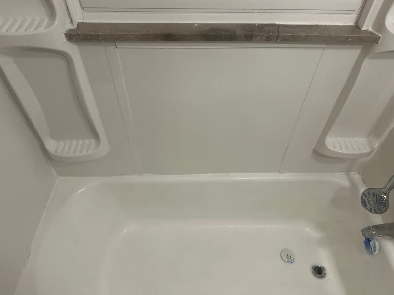 Bathtub and surround after — bright, clean white finish